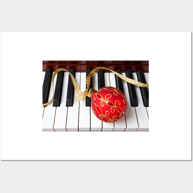 Christmas ornament on piano keys Wall Art by photogarry